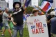 Protestors hold placards during a rally against antisemitism