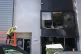 A man works near where fire has damaged a preschool and earl