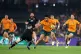 Australia's Pete Samu, center, toys to step around New Zeala