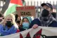 Trade unionists and protesters form a blockade outside weapo