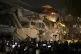 Protesters use heavy machinery to demolish the residence of 