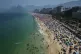 Beachgoers flock to Ipanema beach to beat the extreme heat i