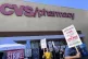 Workers on strike picket in front of a CVS pharmacy on Octob