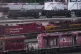 A worker walks past tanker cars and locomotives at the Canad