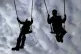Children enjoying playing on swings