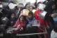 Palestinians line up for free food distribution during the o
