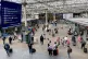 Commuters and travellers at Edinburgh's Waverley Station, Ma