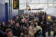Commuters walk along a platform at Waterloo train station in
