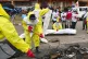 Red Cross workers clear the area in east Congo's second-larg