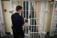 A door is closed by a prison guard at the Cookham Wood Young