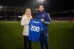 Amanda Crump being presented with her ‎200 shirt by manage