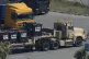 A truck carrying food aid for Gaza to loading on the contain