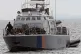 Migrants aboard a Cyprus marine police patrol boat are broug