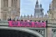 Activists unfurl a banner bearing the words ‘Stop pollutin