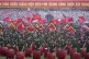 People participate in a parade commemorating the victory of 