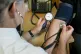 A doctor checking a patient's blood pressure at the Temple F