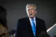 President Donald Trump speaks to reporters next to Air Force