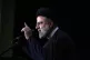 Iranian President Ebrahim Raisi speaks during a commemoratio