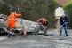 Council workers clear debris from the area immediately aroun