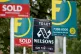 Letting and estate agents signs outside flats on the Old Ken