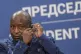 Burundi President Evariste Ndayishimiye adjusts his earphone