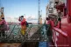 Rescued refugees leave the Ocean Viking rescue ship and step