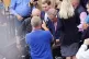 Leader of Reform UK Nigel Farage has a drink thrown over him