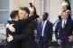 French President Emmanuel Macron (second left) greets Ukrain