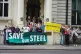 Climate and workers rights groups hold a demonstration outsi