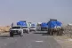 United Nations vehicles carrying aid drive along the Palesti