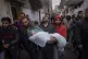 Mohammad Shouman carries the body of his daughter, Masa, who