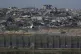 Destroyed buildings stand in the Gaza Strip as seen from sou
