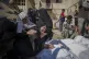Palestinians mourn their relatives killed in the Israeli bom