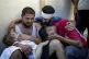 Palestinian Mahmoud Mikdad holds the body of his 21-month-ol