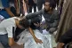 Palestinians mourn a relative killed in the Israeli bombardm