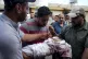 Relatives mourn a child killed in the Israeli bombardment of