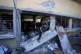 Palestinians search for the bodies of their relatives killed
