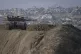 An Israeli armoured vehicle sits on an Israeli army position