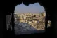 Palestinians walk through the destruction in the wake of an 