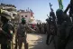 Hamas and Islamic Jihad militants secure the area as Red Cro