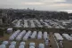
A tent camp for displaced Palestinians is set up amid destr