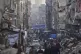 Palestinians walk amid the destruction caused by the Israeli