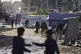 Displaced Palestinians carry water in Jabaliya, Gaza Strip o