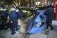Police remove protesters’ tent camp on a street during a r