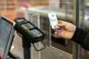 An asylum seeker pays for his purchase with a special paymen