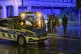 Late in the evening, a man concealed behind police officers 