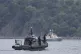 Frontex, foreground, and Greek coast guard vessels take part