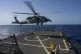 An HSC-7 helicopter lands on the Arleigh Burke-class guided 