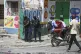 Police patrol a corner during an anti-gang operation in the 