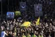 Mourners shout slogans as they carry the coffins of Hezbolla